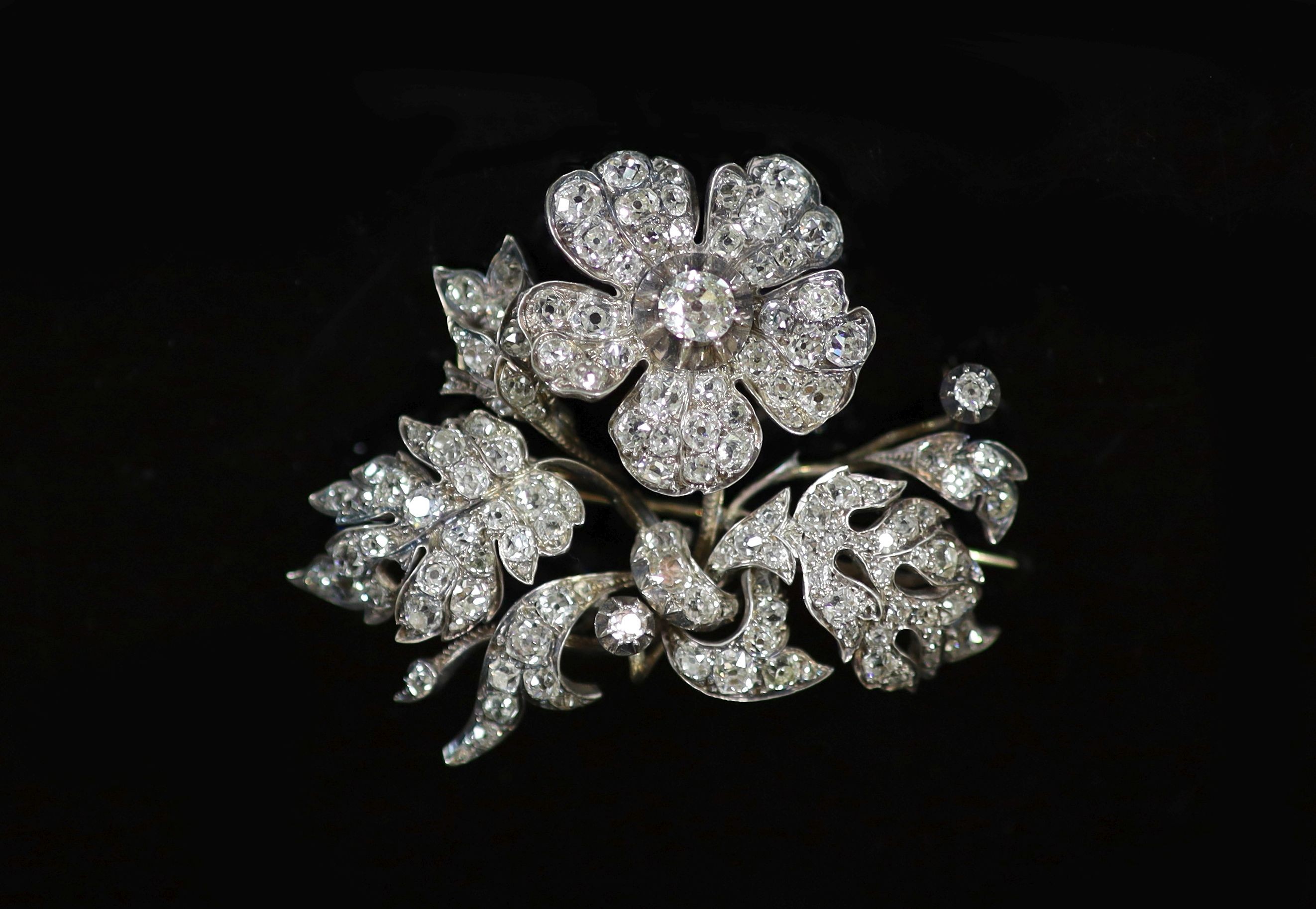 A Victorian gold, silver and diamond encrusted floral spray brooch